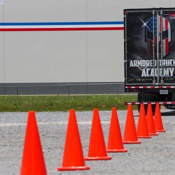 semi truck with orange saftey cones
